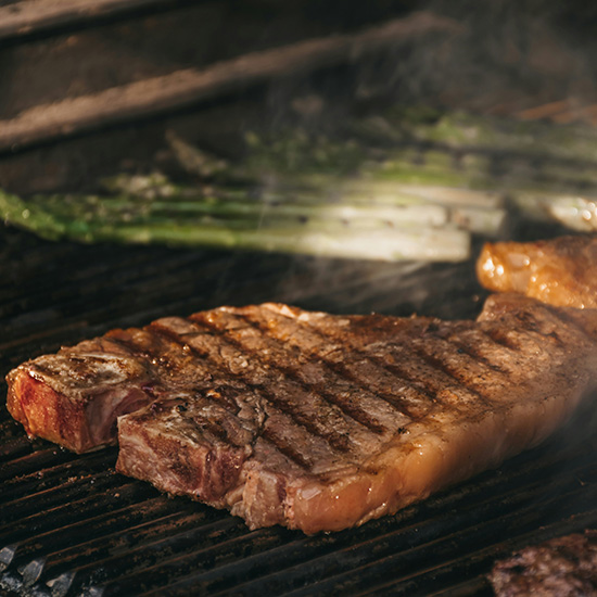 Pitmaster Steak Plate on the grill
